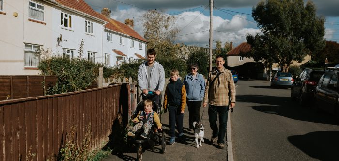 A family walking through affordable housing