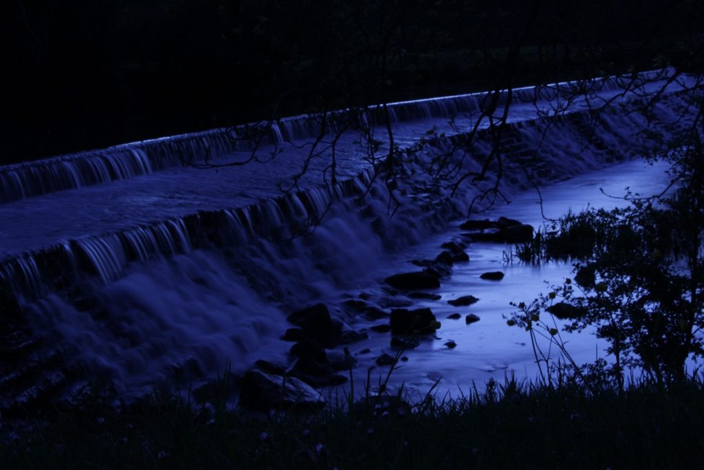 Tellisford Weir waterfalls rush at night