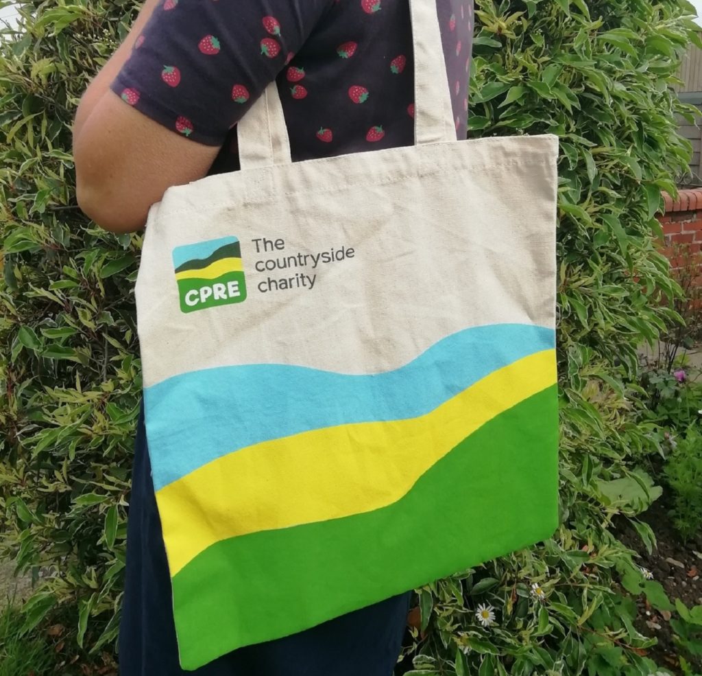 A woman models the new cpre bag