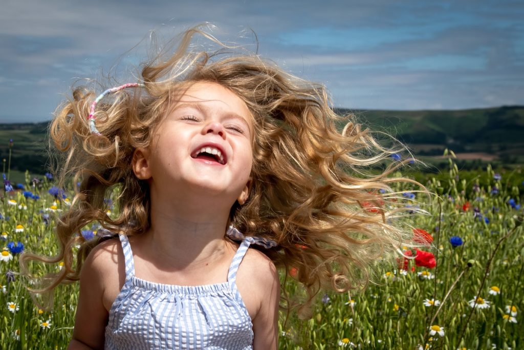 A child having fun in a meadow