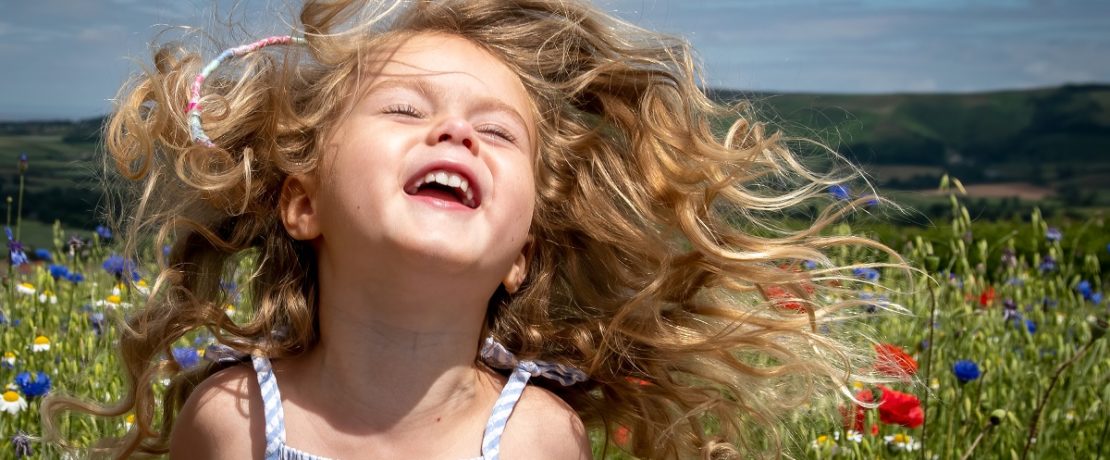 A child having fun in a meadow