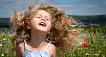 A child having fun in a meadow