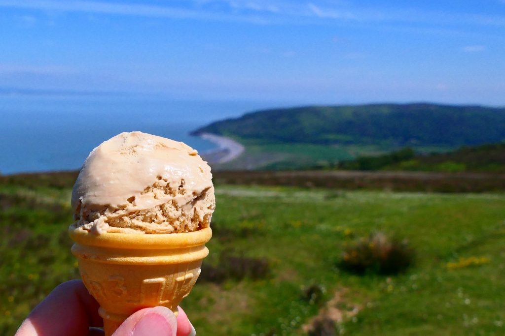 An ice cream cone in front of the coast