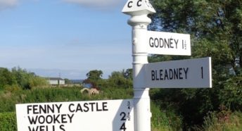 A fingerpost points left to Fenny Castle, Wookey and Wells; right to Godney and straight forward to Bleadney