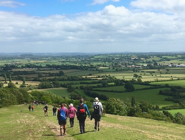 A group of walkers look over the countryside