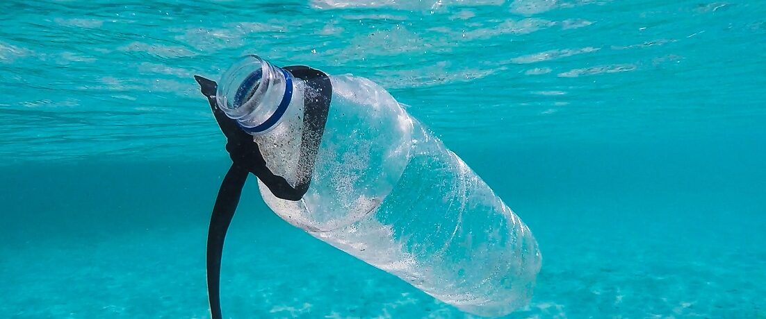 plastic bottle floating in ocean