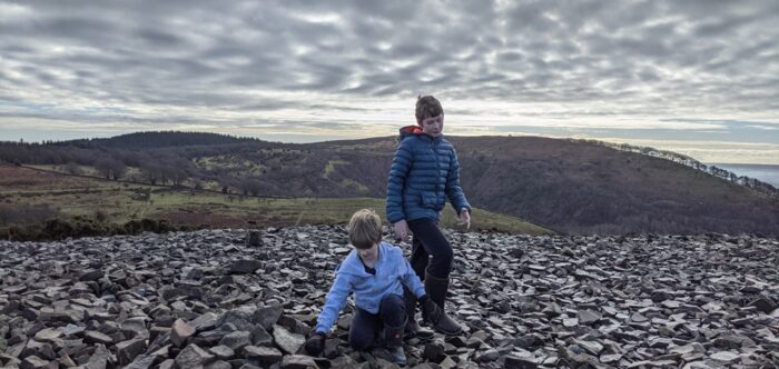 two boys in a field of rocks