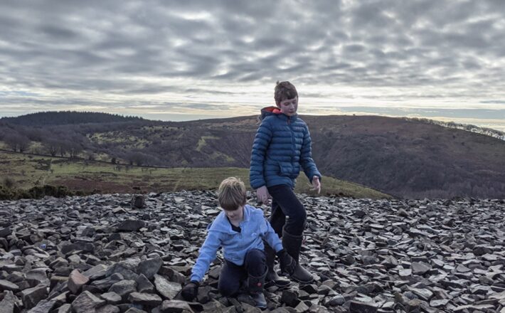 two boys in a field of rocks
