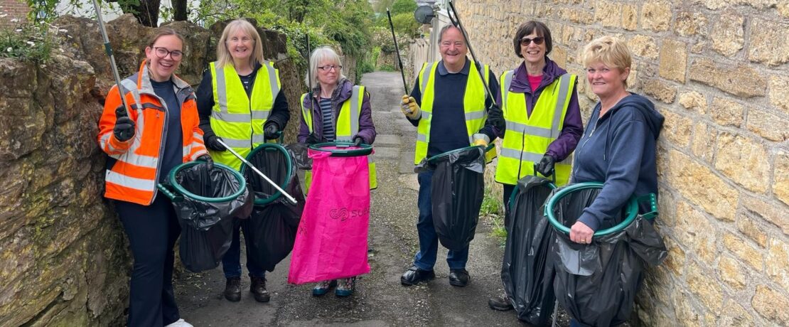 a group of people litterpicking