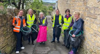 a group of people litterpicking