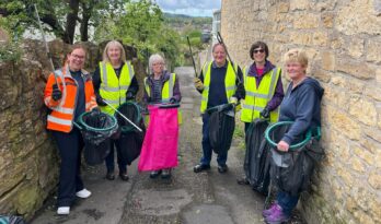 a group of people litterpicking