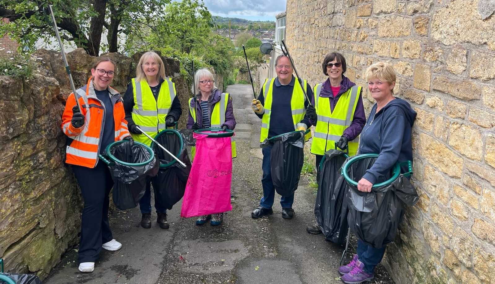a group of people litterpicking