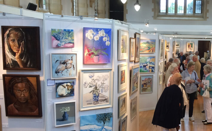 people looking at an art exhibition