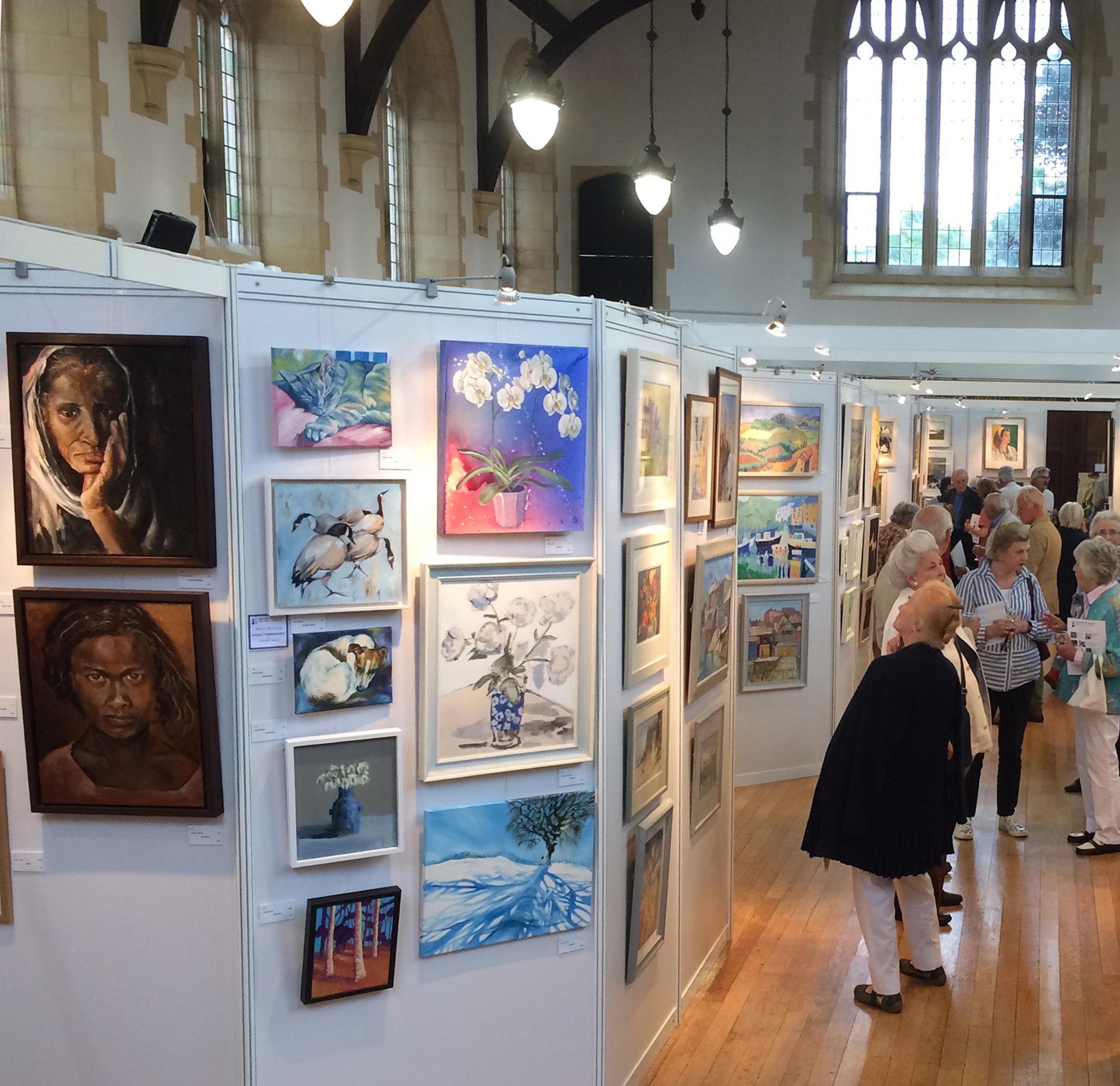 people looking at an art exhibition