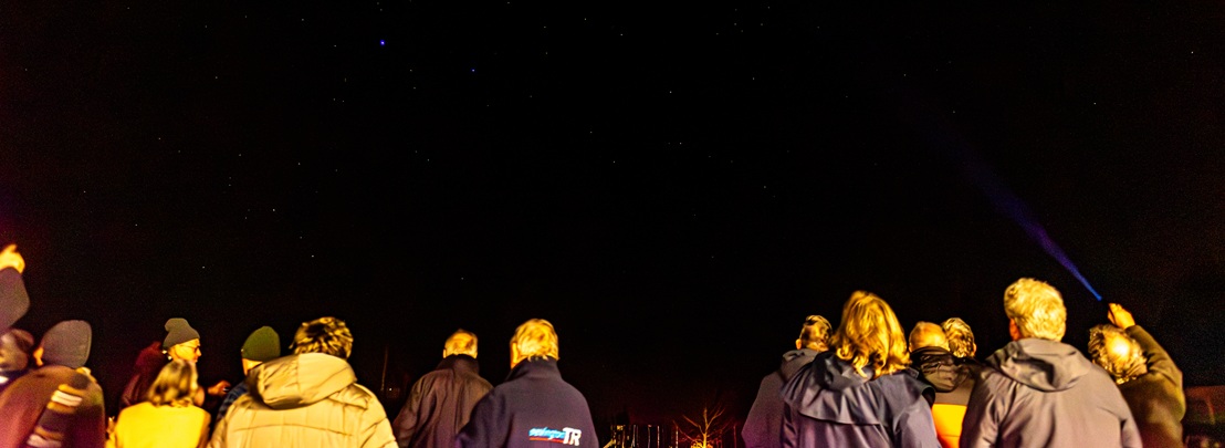 people looking at the night sky