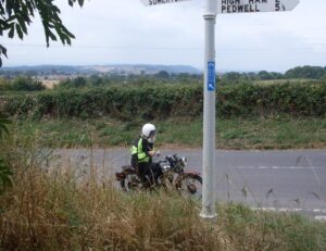 vintage motorcycle and fingerpost