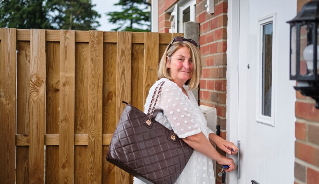 woman opening front door