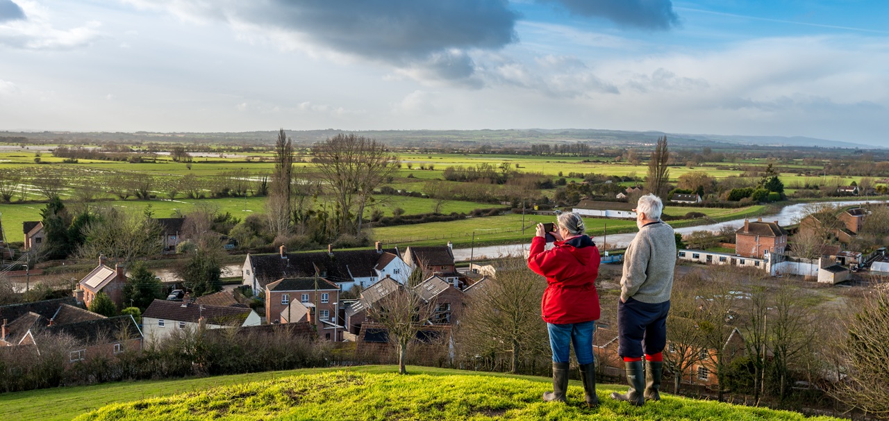 couple looking out across Somerset Levels