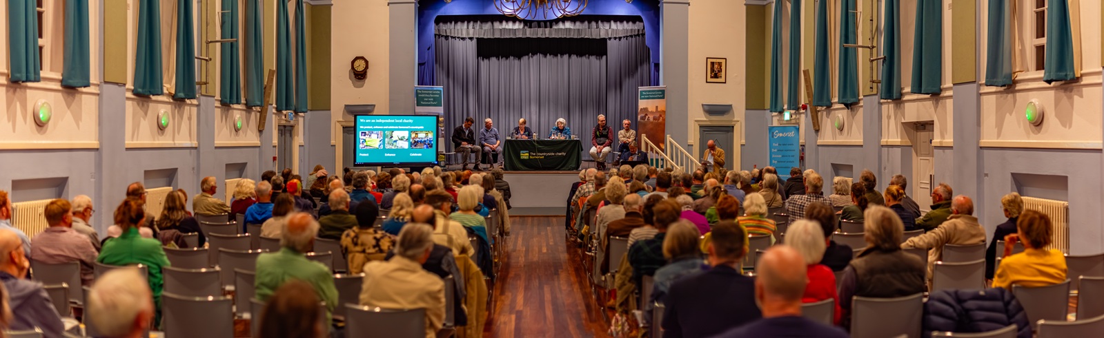 audience & panel at public event