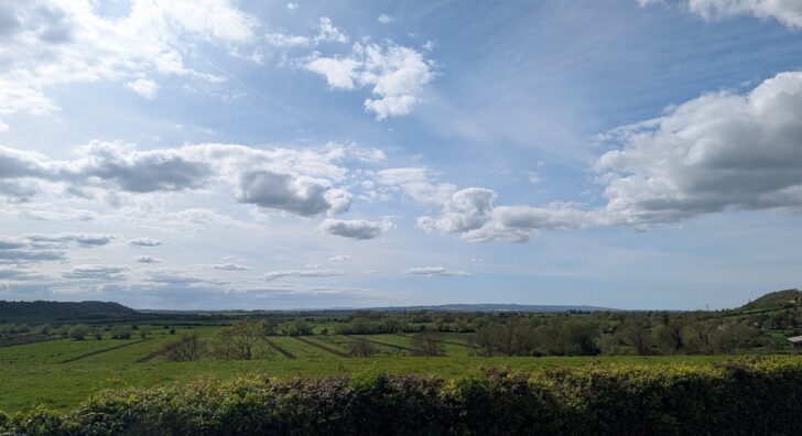 view across flat land with clouds